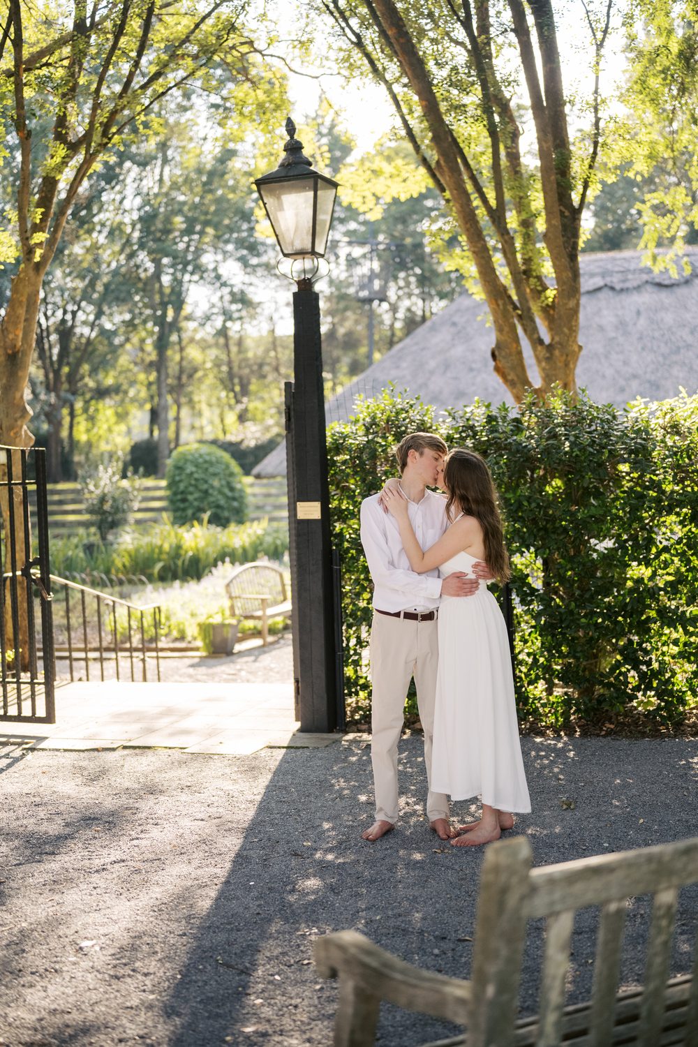 Colton and Ashlyn beside a lamppost at dusk.