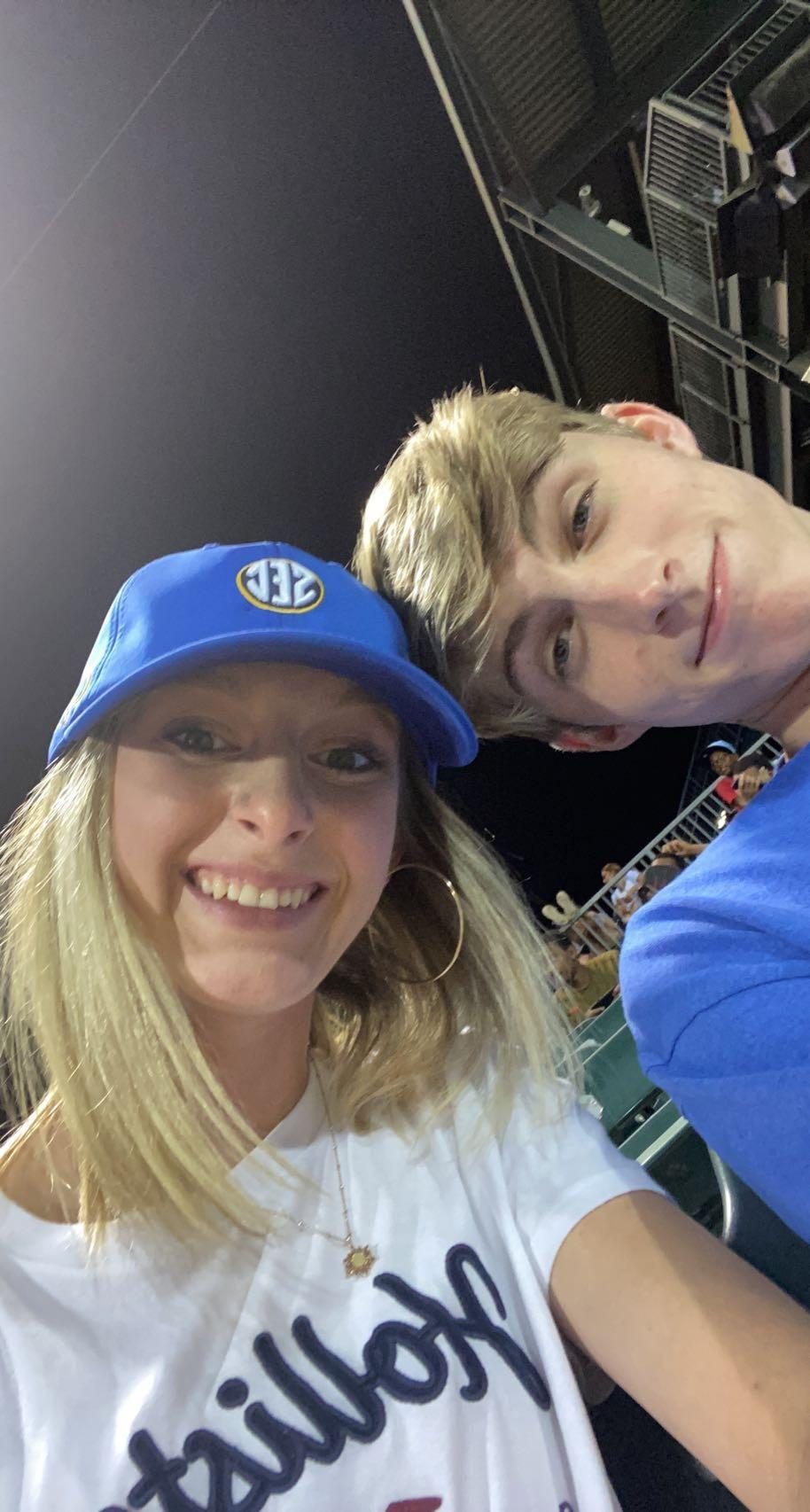 Colton and Ashlyn at Riverwalk Stadium, taking a selfie in the stands.